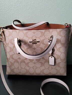 Coach Mollie Tote 25 in Signature Canvas (in Light Khaki/Chalk).